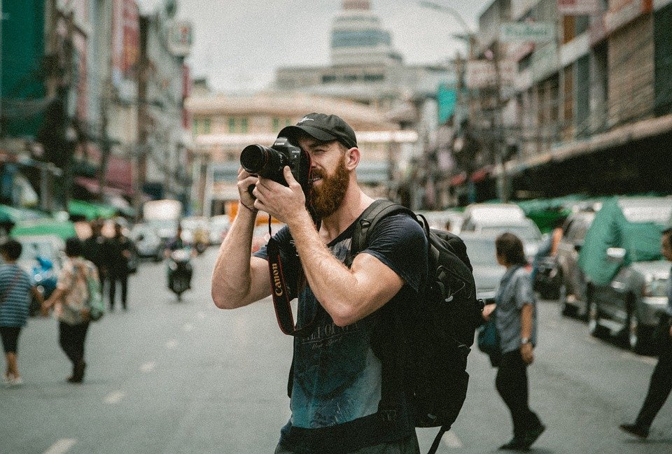 a person photographing on a street
