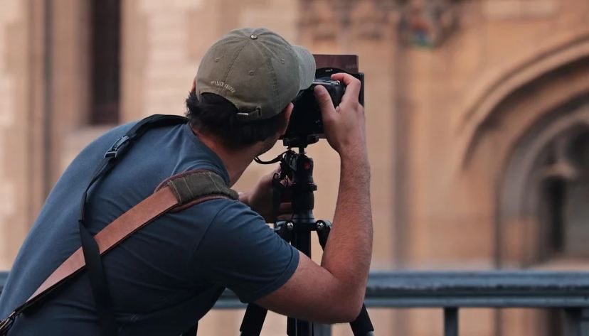 Picture of a man taking different angles for a photography shoot.