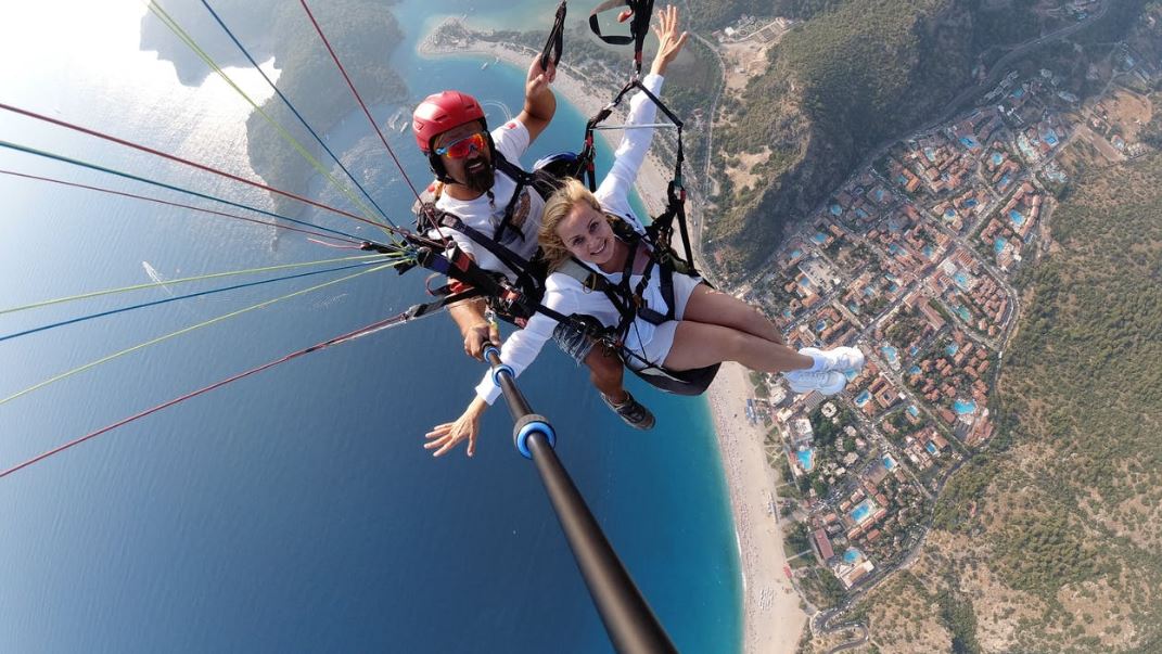 Taking a selfie using a selfie stick