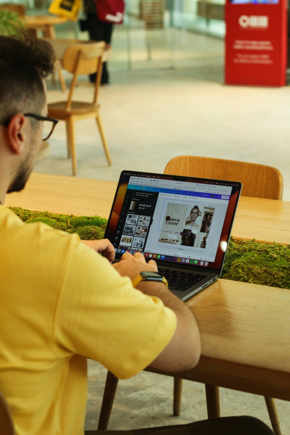a man making some post photo processing on a lap top