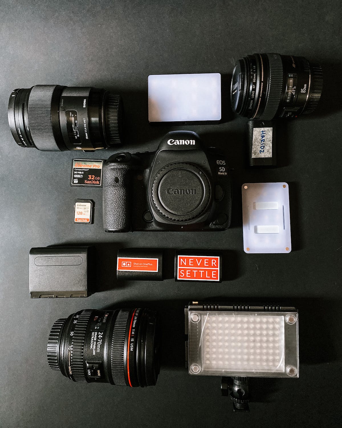 a set of camera equipment that includes memory card and battery