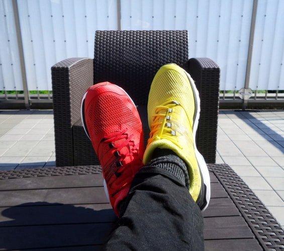 a pair of red and yellow sneakers