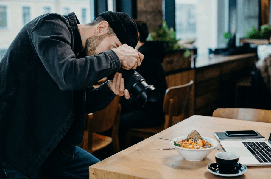 a photographer taking a picture of food