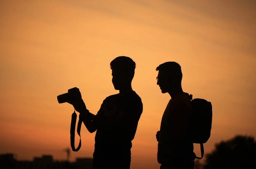 men-silhouettes-camera-photographer