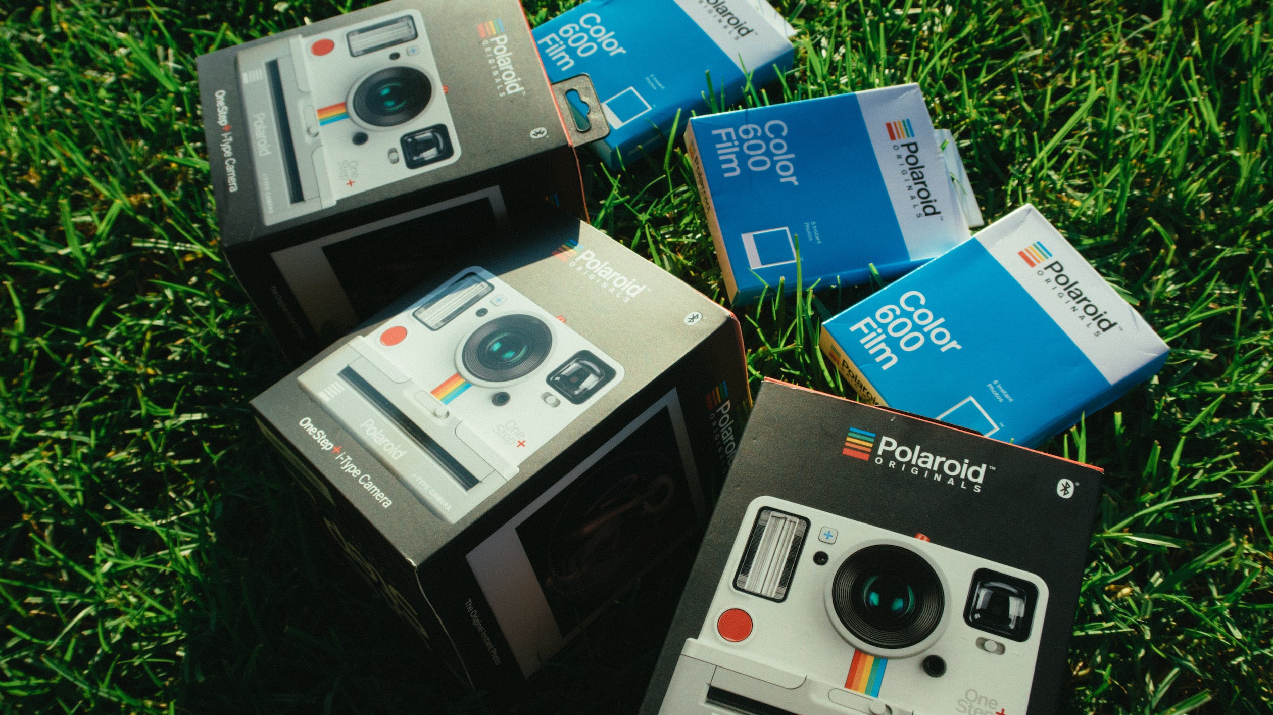 Three Polaroid Camera Boxes and color film