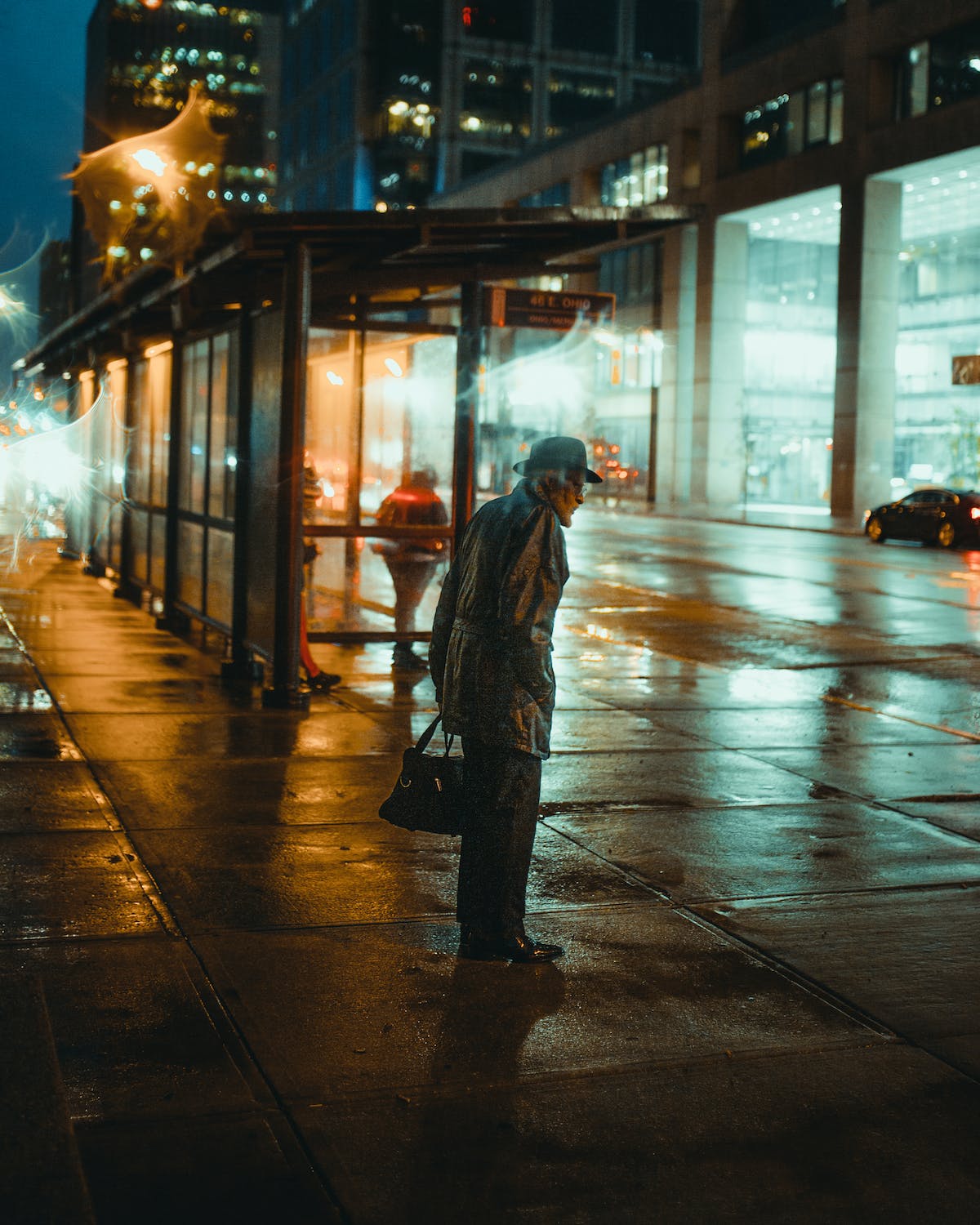 photo of an old man on sidewalk